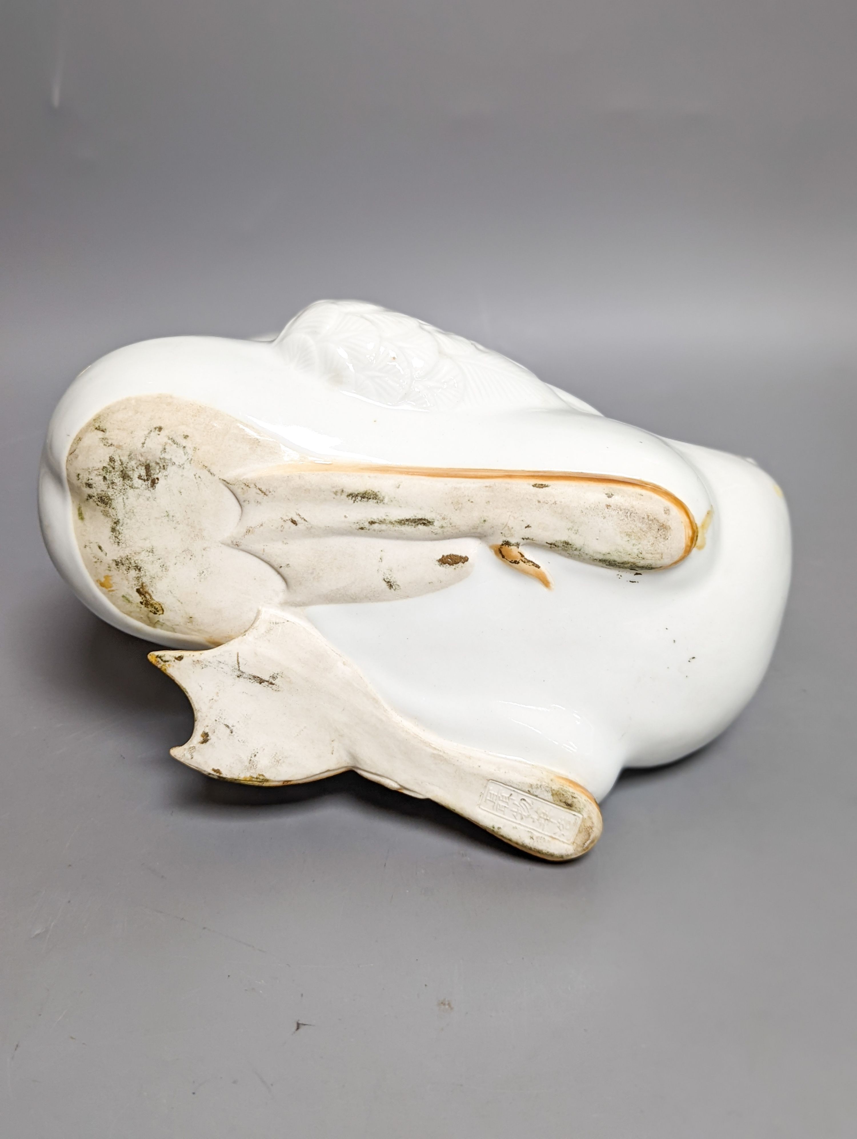 A modern painted decoy duck and a 20th century Chinese ceramic model duck (2) 42cm
